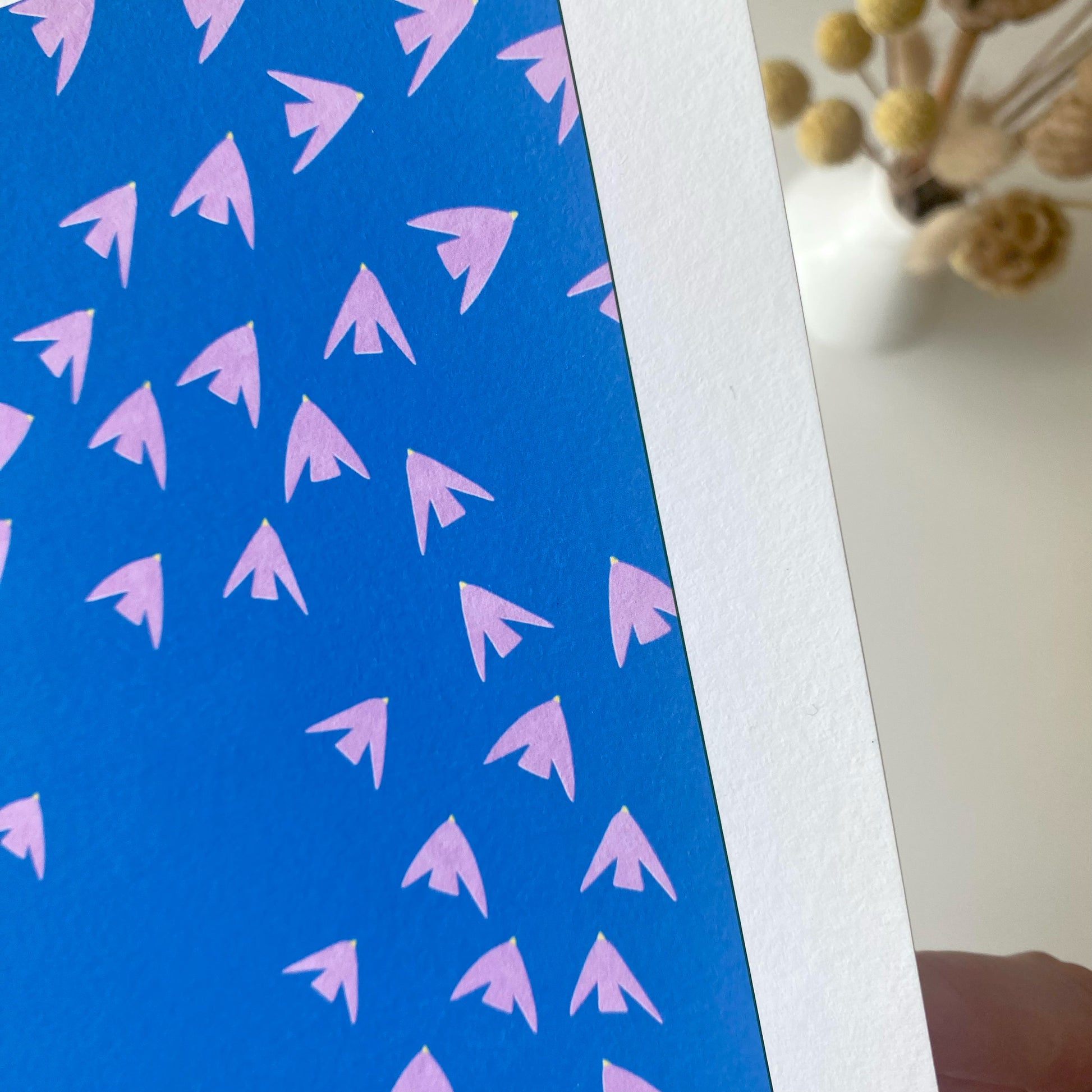 Slightly imperfect print of pink birds against a blue sky! High-quality, independently designed wall-art and prints for your home, perfect for bringing a little nature into any living space! Low-waste, sustainable, imperfect prints sale!