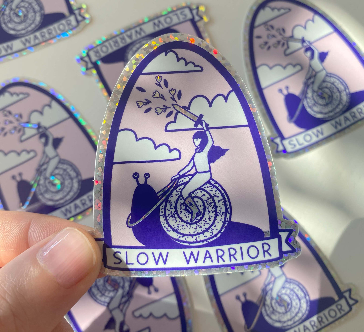 Glittery vinyl 'Slow Warrior' sticker! Celebrate slow living and a mindful life. Perfect for decorating laptops or notebooks. Water and UV- resistant. Sales support nature conservation through European Rewilding projects!